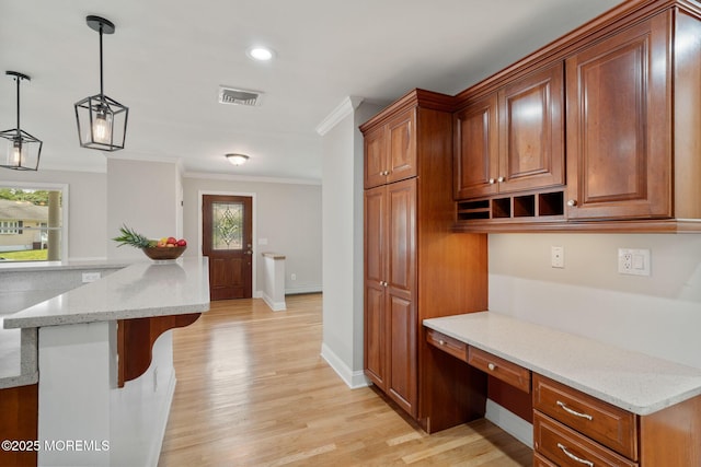 6 Frances Ct, Red Bank, NJ 07701 - kitchen with built in study area, crown molding, plenty of natural light, light wood finished floors, and recessed lighting
