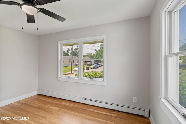 6 Frances Ct, Red Bank, NJ 07701 - unfurnished room with a baseboard heating unit, healthy amount of natural light, light wood-style flooring, and a ceiling fan