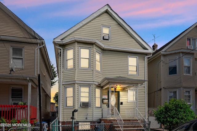 612 Grier Ave, Elizabeth, NJ 07202 - view of front of home with a fenced front yard, cooling unit, and a gate