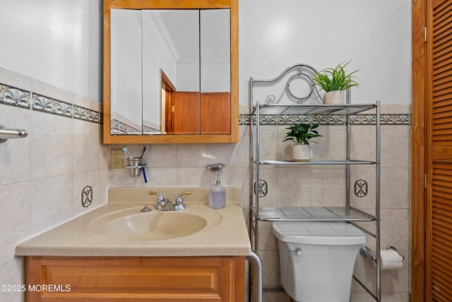 612 Grier Ave, Elizabeth, NJ 07202 - half bath featuring tile walls, vanity, crown molding, and a closet