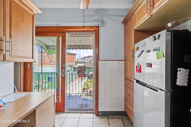 612 Grier Ave, Elizabeth, NJ 07202 - kitchen with freestanding refrigerator, tile walls, light tile patterned floors, light countertops, and ornamental molding