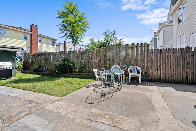 612 Grier Ave, Elizabeth, NJ 07202 - fenced backyard with a patio and outdoor dining area