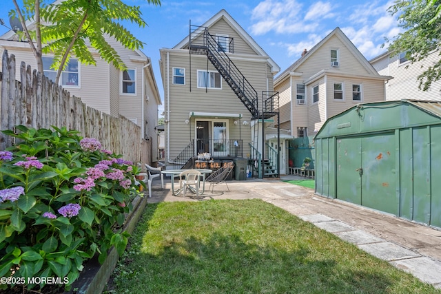 612 Grier Ave, Elizabeth, NJ 07202 - back of house with a storage unit and a patio area