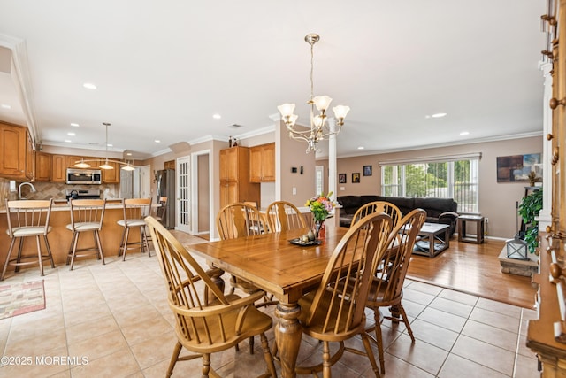 15 Bronia St, Howell, NJ 07731 - dining room featuring light tile patterned floors, crown molding, recessed lighting, and a chandelier