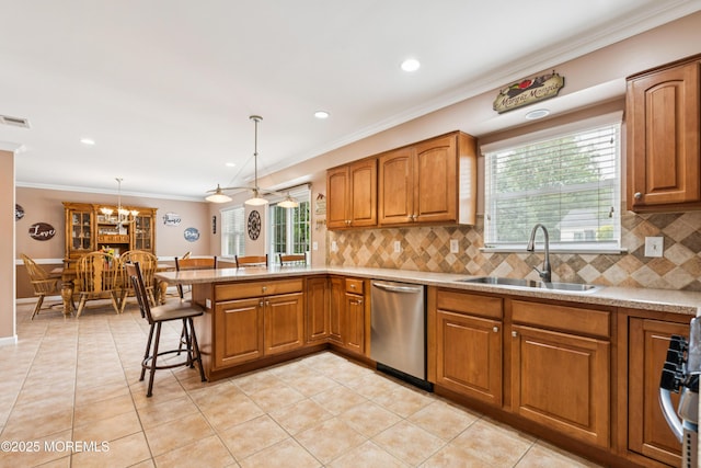 15 Bronia St, Howell, NJ 07731 - kitchen featuring stainless steel dishwasher, brown cabinets, a peninsula, ornamental molding, and tasteful backsplash