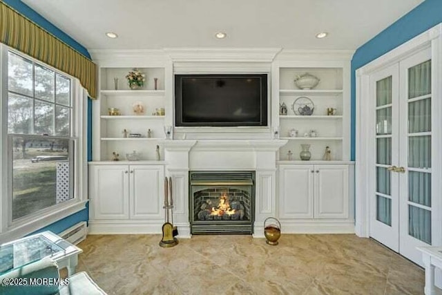 45 Leighton Ln, Manchester, NJ 08759 - unfurnished living room with french doors, built in features, and a warm lit fireplace