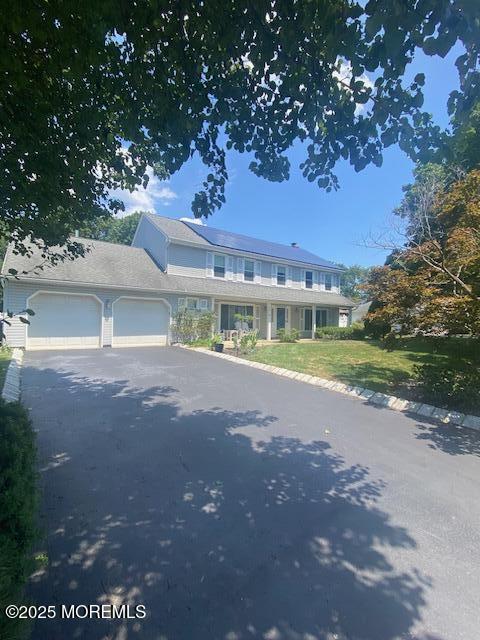 61 Orchard Rd, West Long Branch, NJ 07764 - view of front of house featuring an attached garage and driveway