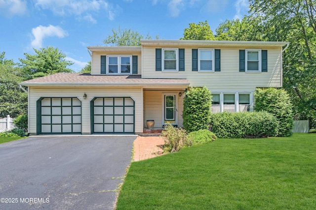 1 Denise Ct, Tinton Falls, NJ 07753 - view of front of property featuring driveway, a front lawn, and a garage