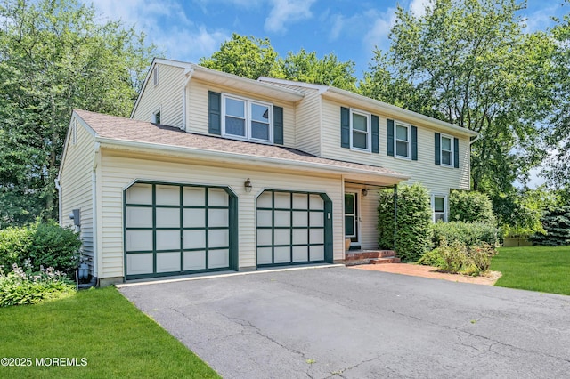 1 Denise Ct, Tinton Falls, NJ 07753 - view of front of property with driveway, a front lawn, and an attached garage
