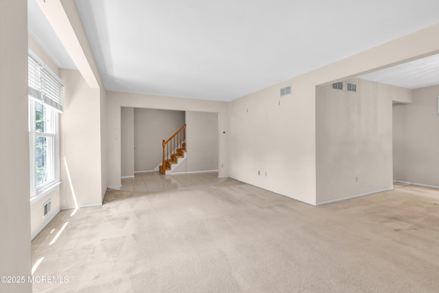 1 Denise Ct, Tinton Falls, NJ 07753 - spare room with stairway and carpet floors