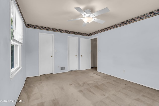 1 Denise Ct, Tinton Falls, NJ 07753 - unfurnished bedroom featuring carpet, multiple closets, and ceiling fan