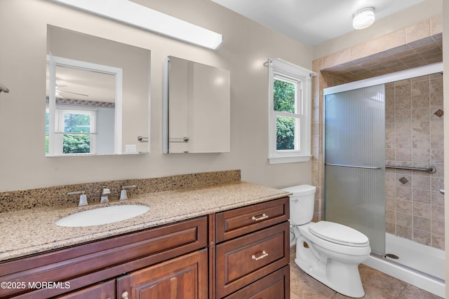 1 Denise Ct, Tinton Falls, NJ 07753 - bathroom featuring vanity, a stall shower, tile patterned floors, and a ceiling fan