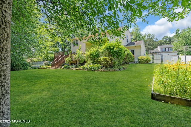 1 Denise Ct, Tinton Falls, NJ 07753 - view of yard featuring stairs, a garden, and a wooden deck