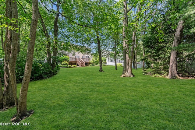 1 Denise Ct, Tinton Falls, NJ 07753 - view of green lawn with stairway and a wooden deck