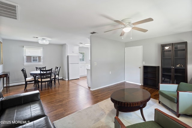 7 Bear Mountain Ct, Toms River, NJ 08753 - living area with ceiling fan, wood finished floors, healthy amount of natural light, and a baseboard heating unit