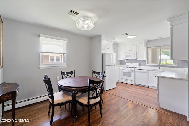7 Bear Mountain Ct, Toms River, NJ 08753 - dining room with a baseboard radiator and dark wood-style floors