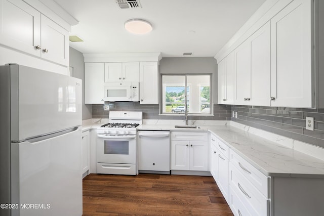 7 Bear Mountain Ct, Toms River, NJ 08753 - kitchen with white appliances, tasteful backsplash, white cabinetry, dark wood-style floors, and light stone counters