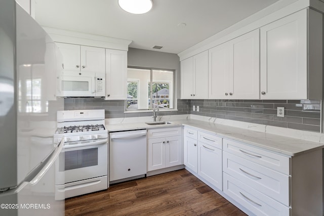 7 Bear Mountain Ct, Toms River, NJ 08753 - kitchen with white appliances, white cabinetry, tasteful backsplash, dark wood-style flooring, and light stone counters