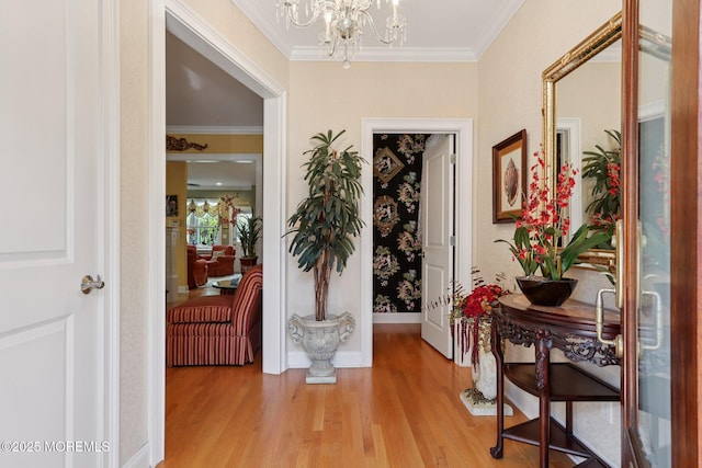 73 Clark Ave, Ocean Grove, NJ 07756 - entryway with light wood-style flooring, a chandelier, and ornamental molding