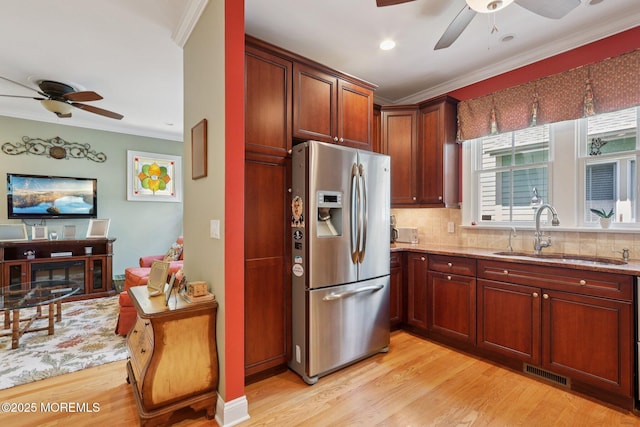 73 Clark Ave, Ocean Grove, NJ 07756 - kitchen with stainless steel fridge with ice dispenser, ceiling fan, crown molding, tasteful backsplash, and light stone countertops
