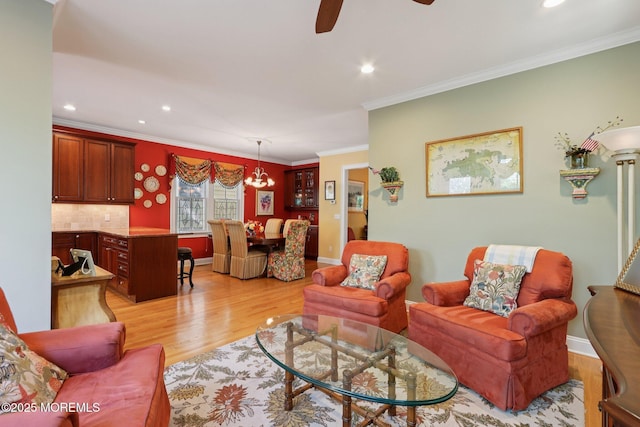 73 Clark Ave, Ocean Grove, NJ 07756 - living area featuring light wood-type flooring, recessed lighting, a ceiling fan, ornamental molding, and a chandelier
