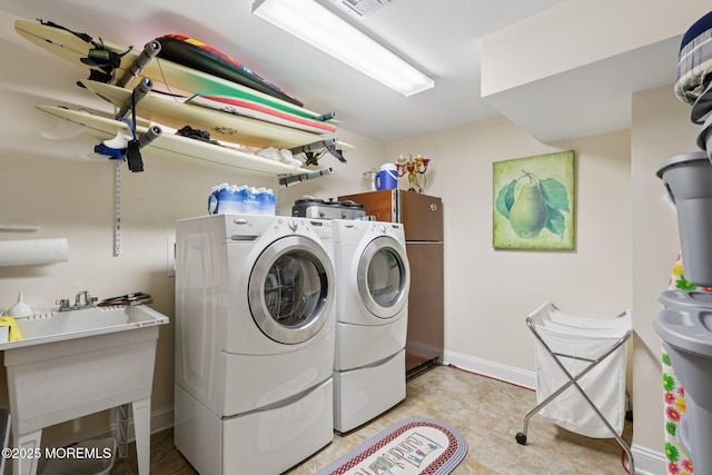 73 Clark Ave, Ocean Grove, NJ 07756 - washroom featuring washing machine and clothes dryer and baseboards