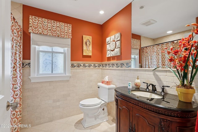 73 Clark Ave, Ocean Grove, NJ 07756 - full bathroom featuring vanity, plenty of natural light, tile patterned floors, tile walls, and wainscoting
