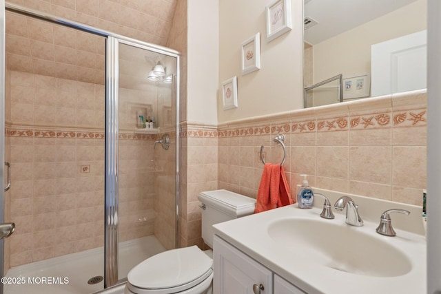 73 Clark Ave, Ocean Grove, NJ 07756 - bathroom featuring a stall shower, vanity, tile walls, and a wainscoted wall