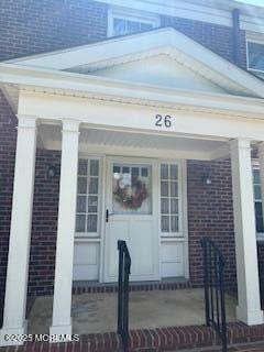 26 Pinckney Rd Unit C, Red Bank, NJ 07701 - property entrance featuring brick siding and a porch