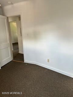 26 Pinckney Rd Unit C, Red Bank, NJ 07701 - empty room featuring dark colored carpet and baseboards