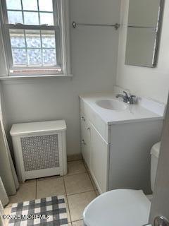 26 Pinckney Rd Unit C, Red Bank, NJ 07701 - bathroom with vanity, radiator, and tile patterned flooring