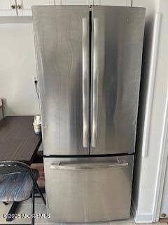 26 Pinckney Rd Unit C, Red Bank, NJ 07701 - kitchen view of freestanding refrigerator and white cabinetry