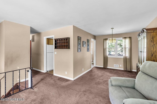123 Susan Dr, Jackson, NJ 08527 - living area with carpet floors and a chandelier