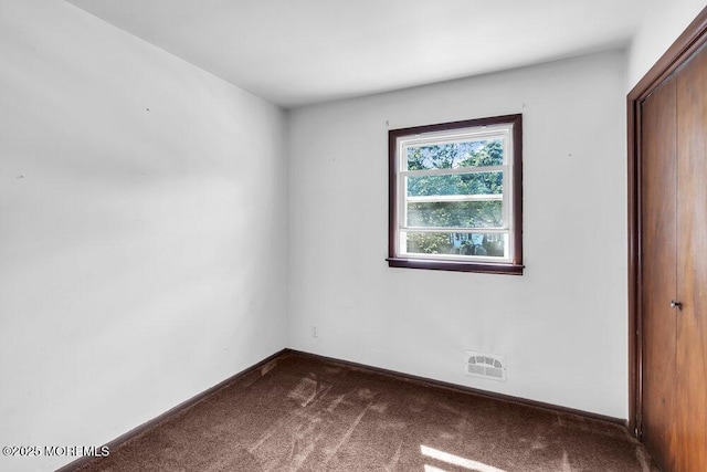 123 Susan Dr, Jackson, NJ 08527 - unfurnished bedroom with dark carpet and baseboards