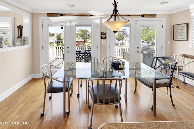 49 Farragut Dr, Brick, NJ 08723 - dining room with french doors, light wood-type flooring, and crown molding