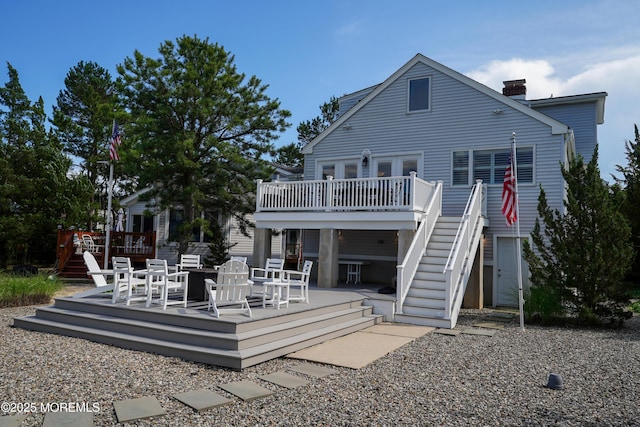 49 Farragut Dr, Brick, NJ 08723 - rear view of house featuring a wooden deck, a chimney, and stairway