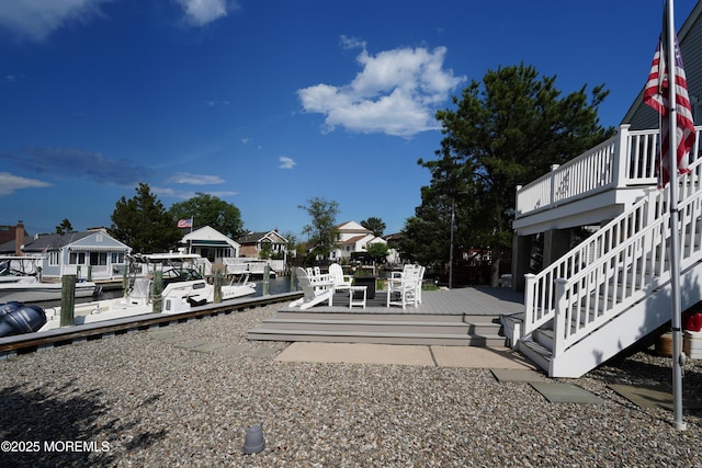 49 Farragut Dr, Brick, NJ 08723 - view of yard featuring a deck, a boat dock, stairs, and a residential view