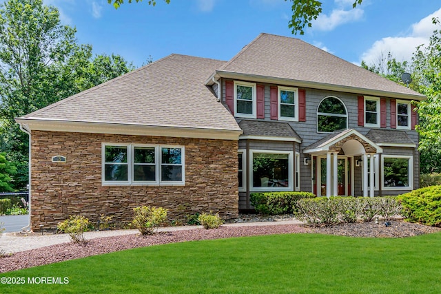 3 Algonquin Ct, Freehold, NJ 07728 - view of front of house with a shingled roof, stone siding, and a front lawn