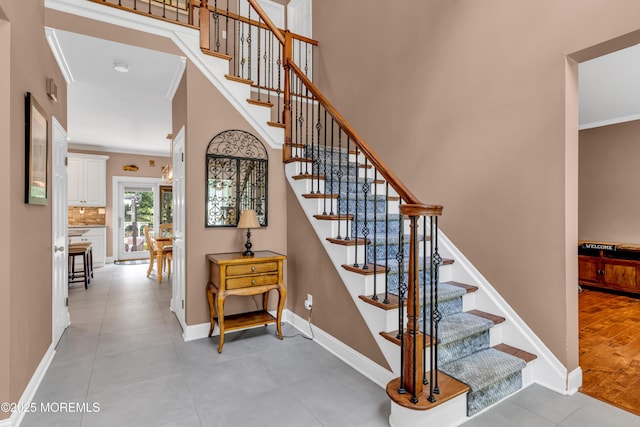3 Algonquin Ct, Freehold, NJ 07728 - staircase with crown molding and tile patterned flooring