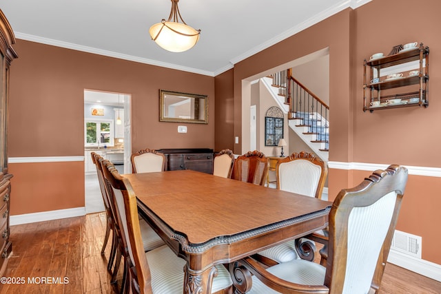 3 Algonquin Ct, Freehold, NJ 07728 - dining room with ornamental molding, hardwood / wood-style flooring, and stairway