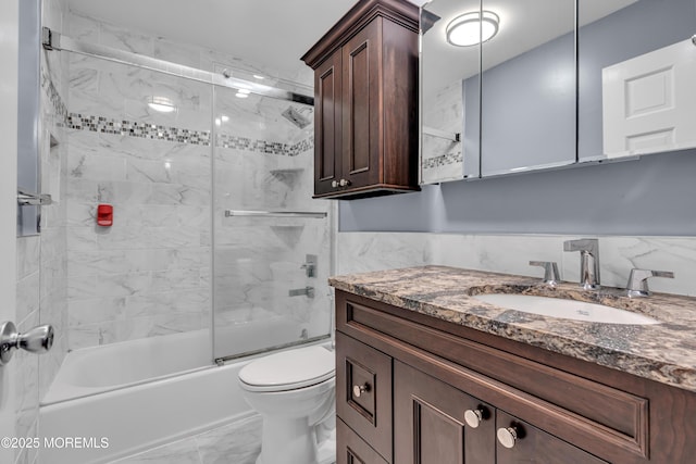 3 Algonquin Ct, Freehold, NJ 07728 - full bath featuring marble look tile flooring, vanity, and shower / bath combination with glass door