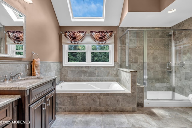 3 Algonquin Ct, Freehold, NJ 07728 - full bathroom with a skylight, vanity, a garden tub, and a shower stall