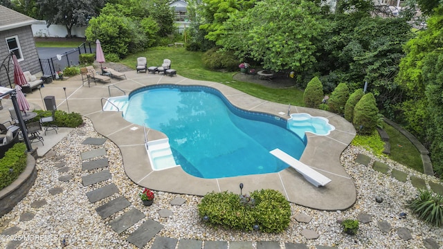 3 Algonquin Ct, Freehold, NJ 07728 - view of pool with a patio area, a diving board, and view of scattered trees