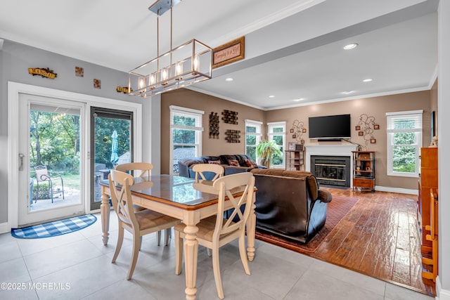 3 Algonquin Ct, Freehold, NJ 07728 - dining room featuring ornamental molding, healthy amount of natural light, a glass covered fireplace, recessed lighting, and a chandelier