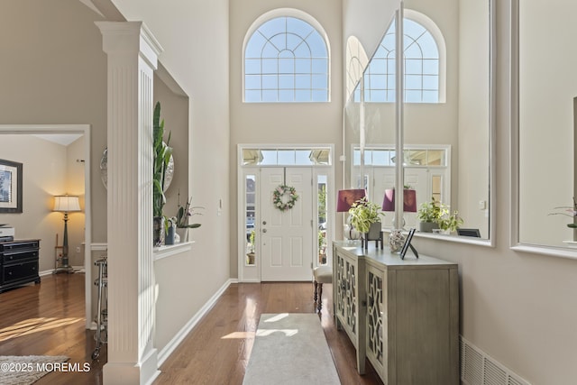 78 Honeysuckle Dr, Manahawkin, NJ 08050 - foyer with wood finished floors, a towering ceiling, and ornate columns