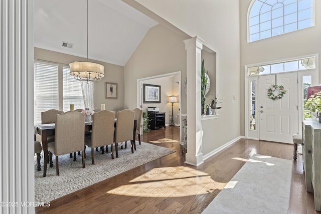 78 Honeysuckle Dr, Manahawkin, NJ 08050 - entrance foyer with high vaulted ceiling, a chandelier, wood finished floors, and ornate columns