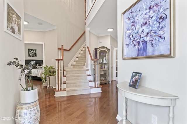 78 Honeysuckle Dr, Manahawkin, NJ 08050 - entryway with ornamental molding, wood finished floors, stairway, and a high ceiling