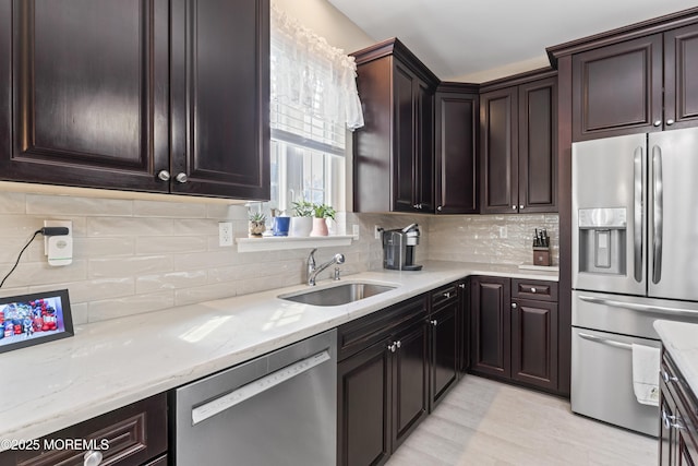 78 Honeysuckle Dr, Manahawkin, NJ 08050 - kitchen with stainless steel appliances, light stone counters, tasteful backsplash, and dark brown cabinetry
