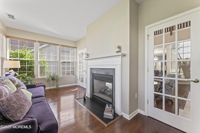 78 Honeysuckle Dr, Manahawkin, NJ 08050 - living room with a glass covered fireplace, plenty of natural light, and wood finished floors