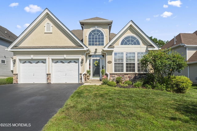 78 Honeysuckle Dr, Manahawkin, NJ 08050 - view of front facade featuring stucco siding, asphalt driveway, stone siding, an attached garage, and a front yard